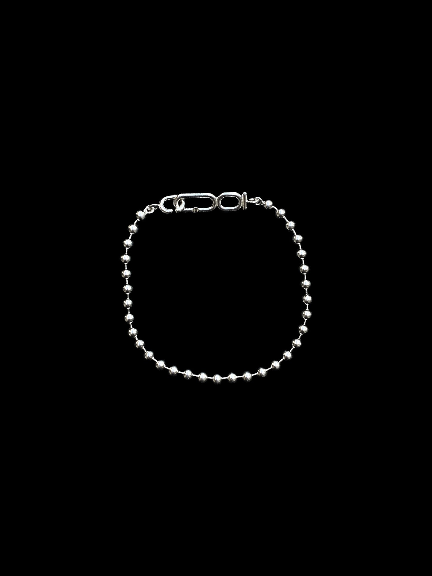 Ball chain bracelet with monogram clasp by Coming Age jewellery studio in Montreal