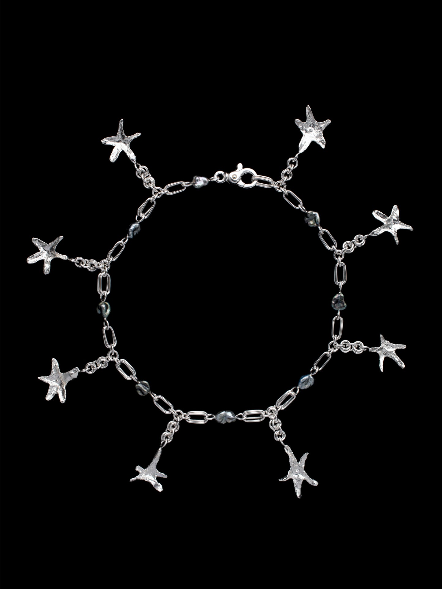 Handmade silver necklace with Keshi pearls with organic star-shaped pendants