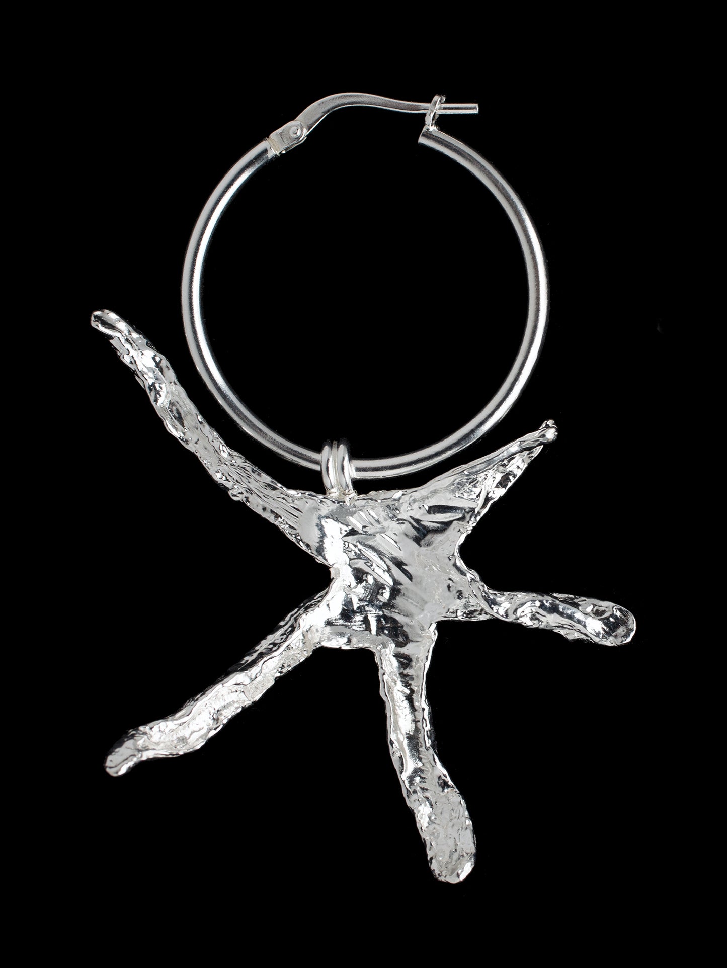 Large organic star shaped hoop earrings handmade in silver