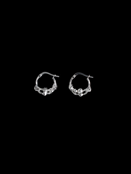 Distorted hoop earrings handmade in silver