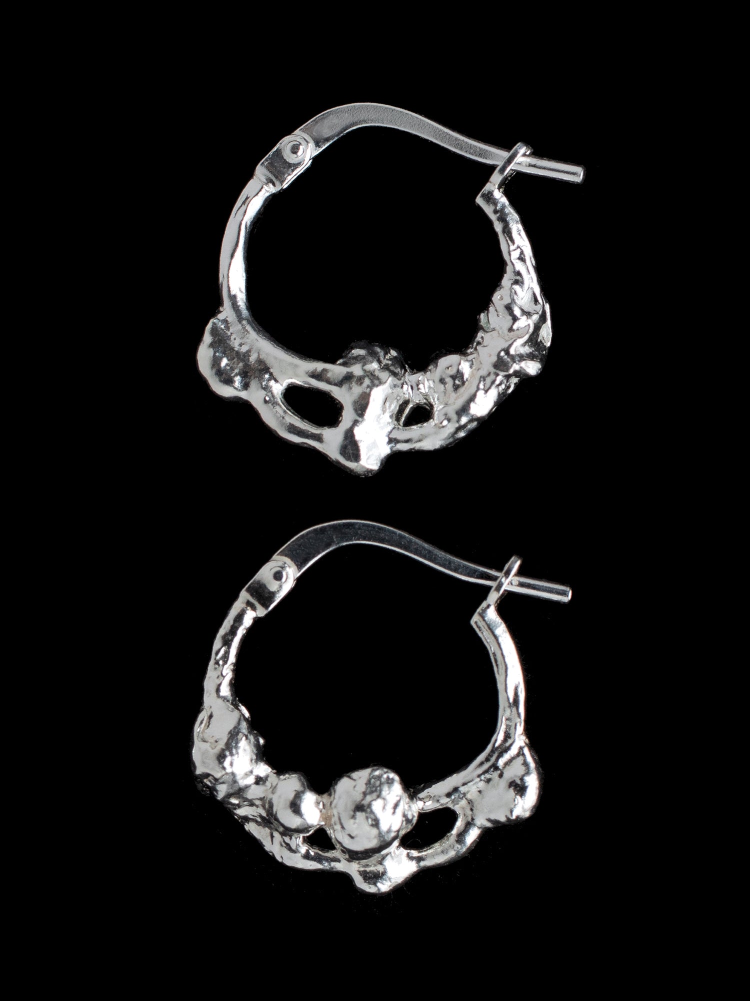 Distorted hoop earrings handmade in silver