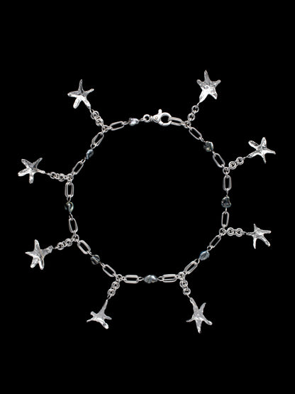 Handmade silver necklace with Keshi pearls with organic star-shaped pendants